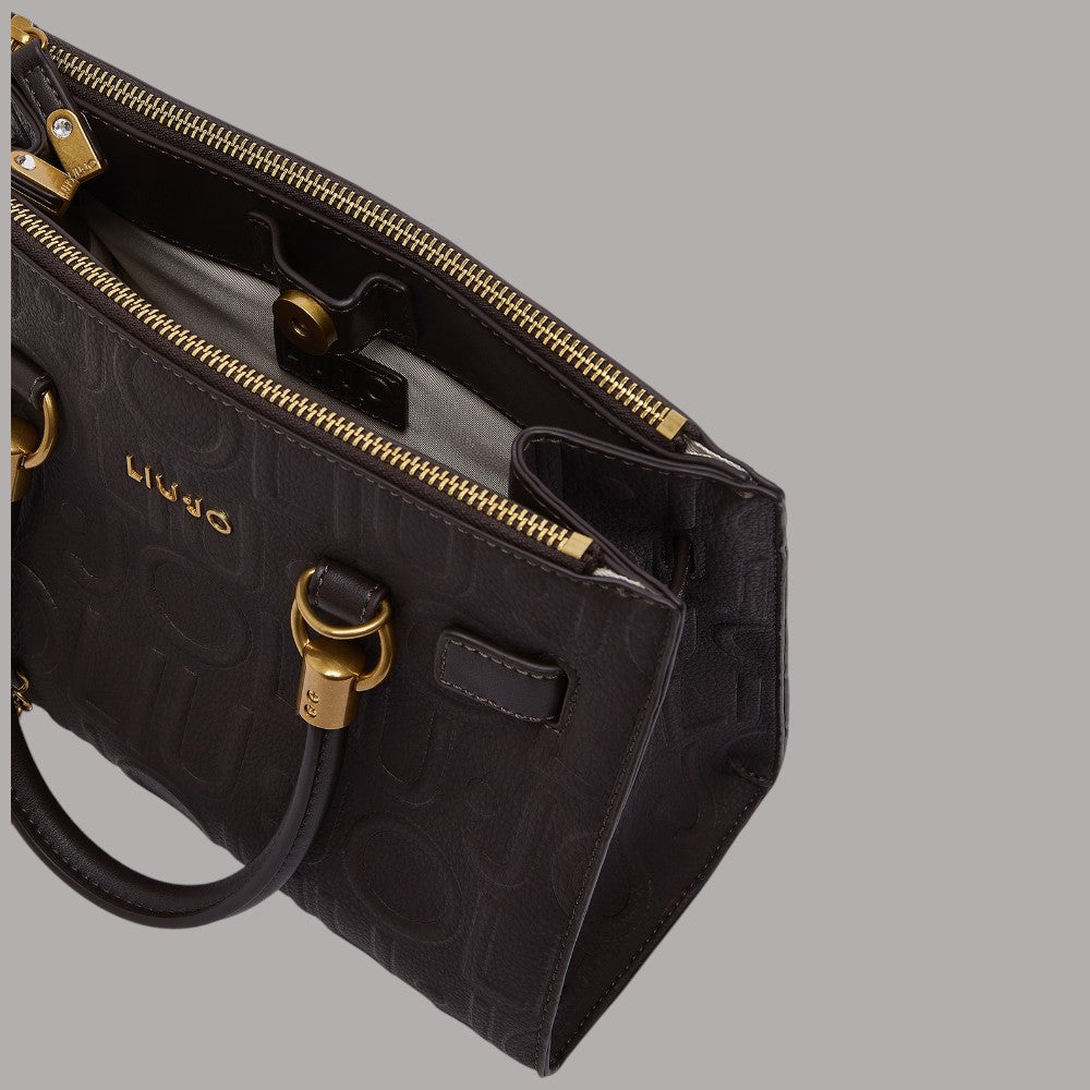 Borsa a mano piccola nera con zip dorata e tasca frontale con fibbia