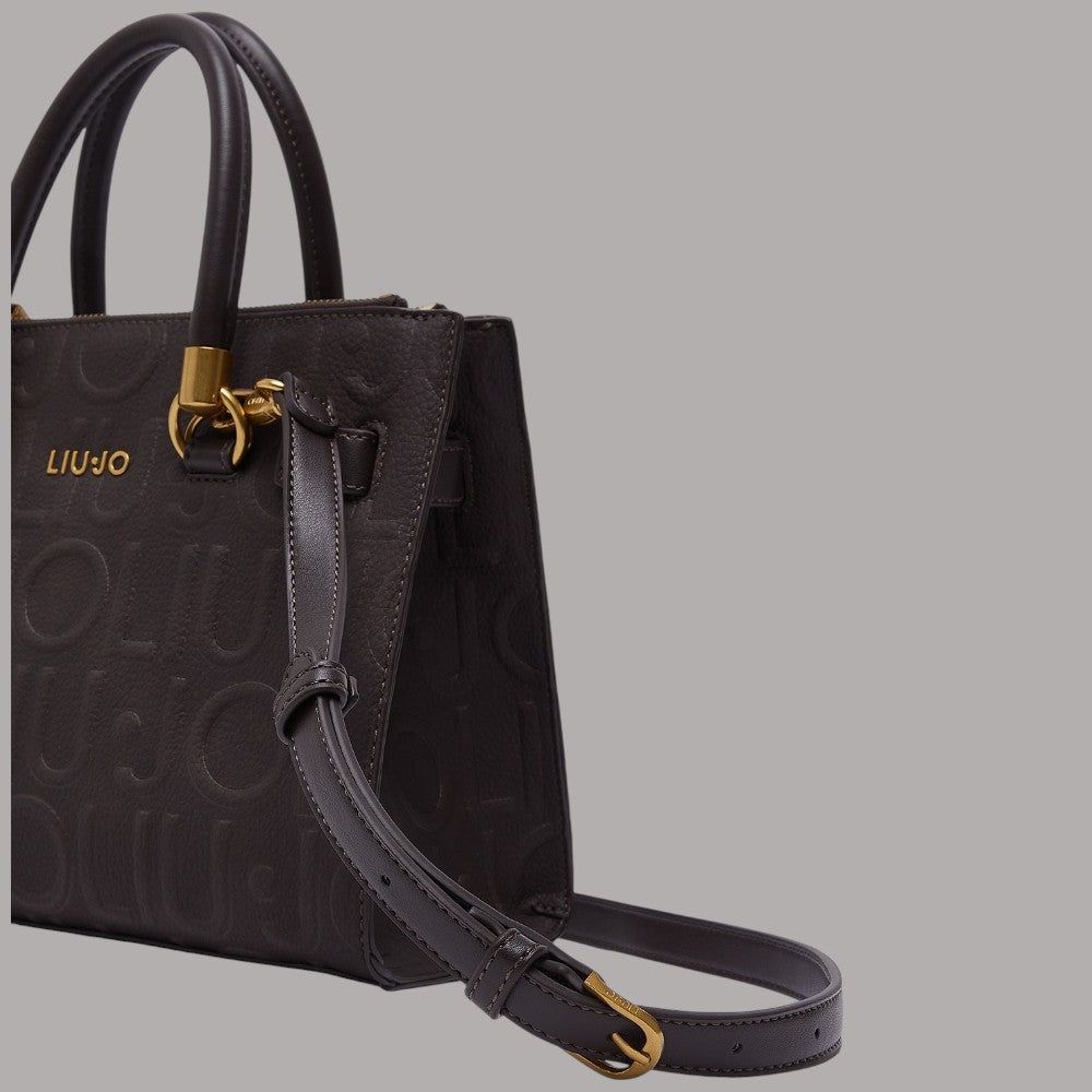 Borsa a mano piccola nera con tracolla regolabile e ciondolo dorato