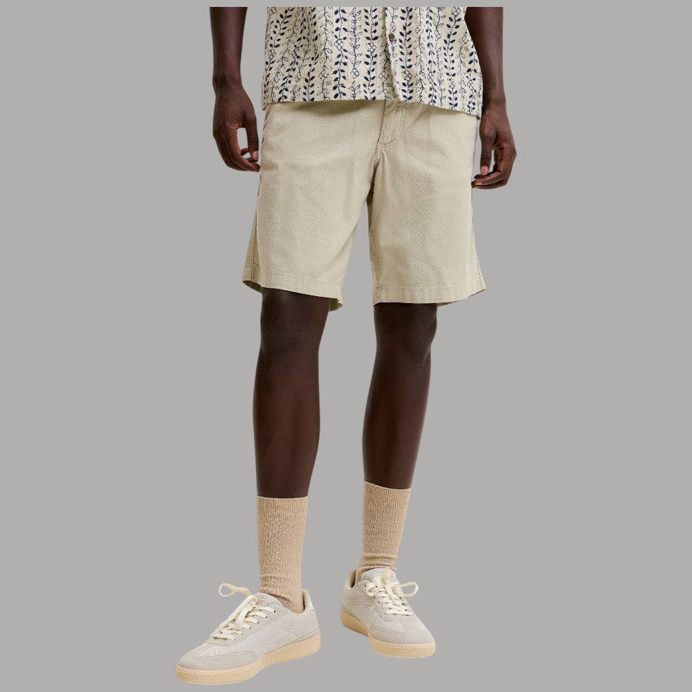 Bermuda in canvas beige con elastico in vita e coulisse, tasche laterali.