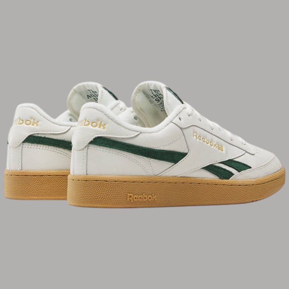 Scarpe Reebok bianche con tallone, inserti verdi e suola gum