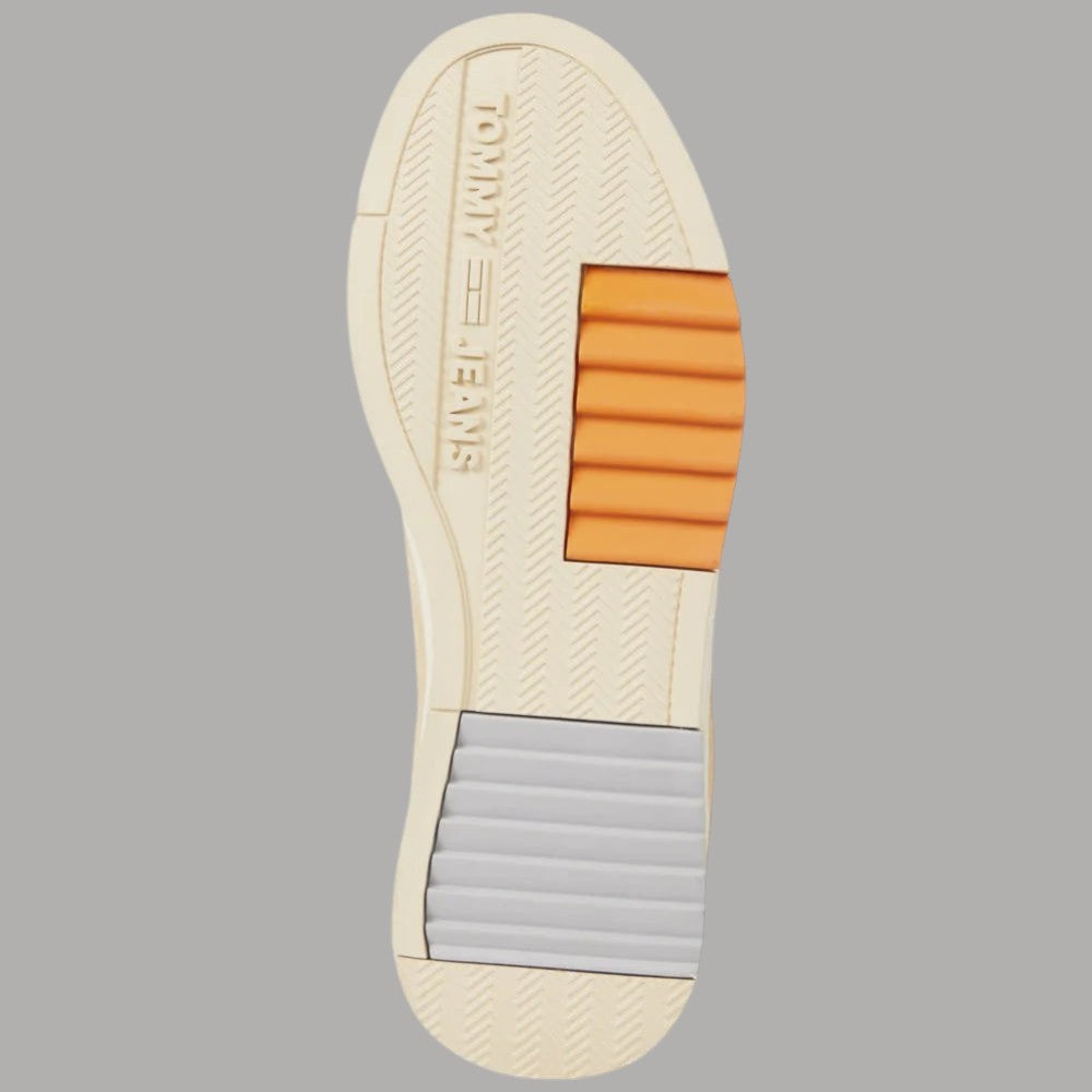 Suola sneakers in beige con inserti arancioni e battistrada a righe