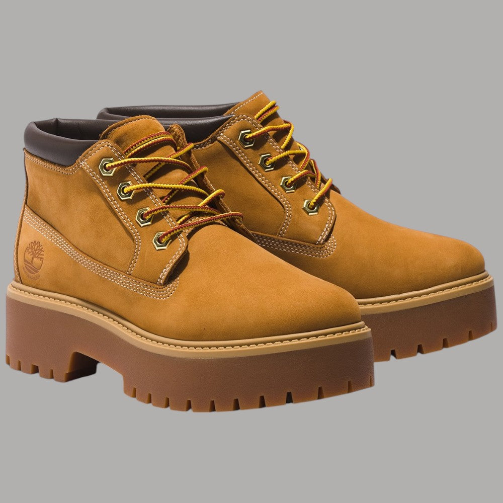 Paio di stivali Timberland gialli in nabuk con lacci e suola platform spessa