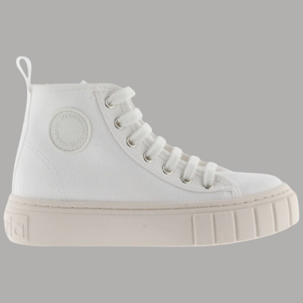Scarpe alte in tela bianche con lacci e suola a righe