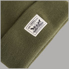 Berretto di maglia verde: etichetta Levi's Two-Horse Pull sul risvolto