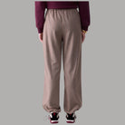 Pantaloni regular fit Liu Jo TF6148T692A beige con texture lucida e elastico in vita
