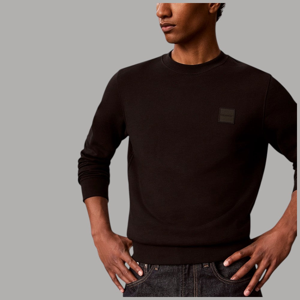 Felpa uomo Calvin Klein nera con patch LV04LH230G e texture liscia