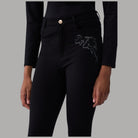 Pantaloni skinny Liu Jo neri con strass e ricamo floreale coure sulla gamba frontale
