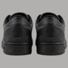 Sneakers grigie e nere Vans con dettagli laterali
