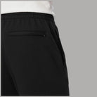 Calvin Klein pantaloni tuta neri con logo grafico LV04LG212G, dettaglio tasca con zip, vista laterale