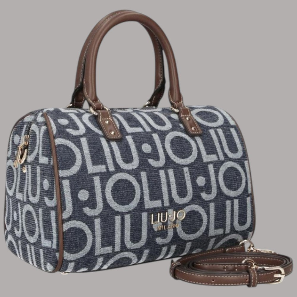 Borsa bauletto blu denim jacquard logato con manici marroni e tracolla regolabile