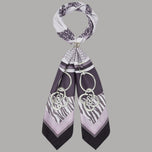Foulard Liu Jo annodato, con stampa geometrica, zebrata e dettagli a catena