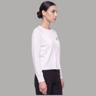 Maglia bianca Liu Jo girocollo vista di profilo, con maniche lunghe e logo sul petto