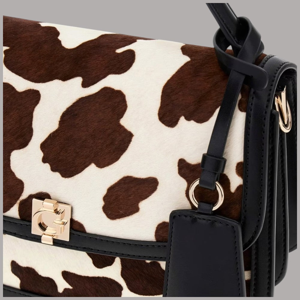 Borsa a mano Guess Audrey crow con stampa cowhide marrone e bianca e tracolla removibile
