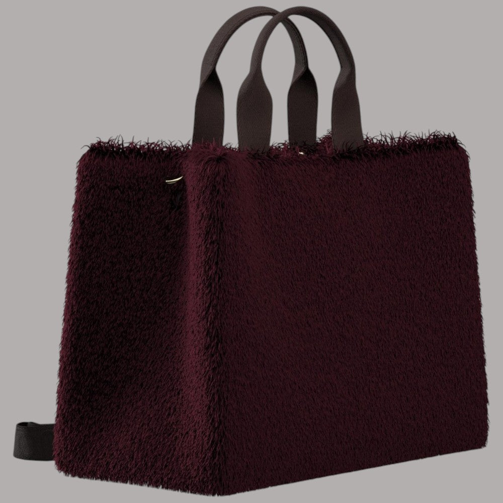 Borsa tote bordeaux in pelliccia con due scomparti e manici in tinta.