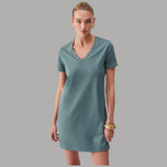 Abito corto verde petrolio in jersey con scollo a V e occhielli decorativi