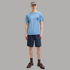 Bermuda in canvas blu scuro con elastico in vita e coulisse, tasche laterali.