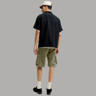 Pantaloncini cargo in cotone verde oliva vista posteriore con tasche laterali