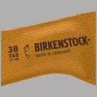 Plantare comfort Birkenstock Birko Tex marrone, dettaglio logo e misure 38 25 17