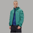 Giacca a vento uomo verde con cappuccio, zip frontale e tasche con zip