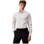 Camicia bianca Calvin Klein a maniche lunghe con bottoni frontali