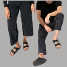 Ciabatte Birkenstock Arizona nere con fibbie regolabili, indossate