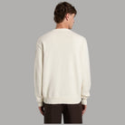 Maglione in cotone ecru sul retro con girocollo a coste e orlo a costine