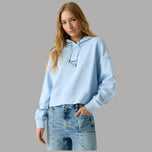 Felpa Guess corta celeste in cotone con cappuccio e logo ricamato sul petto