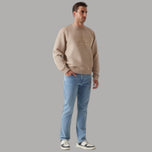 Jeans uomo azzurri a gamba dritta, look usurato, vita con elastico