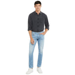 Jeans slim tapered Guess blu chiaro con taglio affusolato