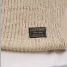Maglione a coste beige chiaro con etichetta JACK & JONES sul busto.