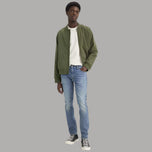 Jeans slim tapered blu elastici da uomo in denim, cinque tasche e cintura