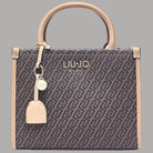 Borsa tote monogram testa di moro con manici in pelle chiara e accessori metallici