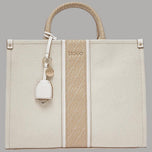 Borsa media in tessuto crema con inserti jacquard e charm removibile a tracolla