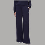 Pantaloni flare in tessuto scuba blu scuro, vita alta elastica, gamba ampia