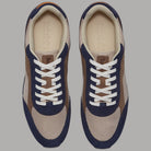 Sneaker Timberland con tomaia beige e pannelli blu, lacci bianchi e interno chiaro