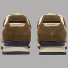 Sneaker Timberland con tomaia in camoscio marrone e inserti beige, suola blu