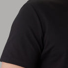 T-shirt nera girocollo con manica corta, tessuto a maglia compatta