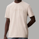 T-shirt beige in cotone con logo goffrato Calvin Klein