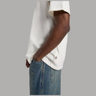 T-shirt Dickies ecru con manica e orlo; piccolo dettaglio etichetta sul fianco