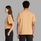 T-shirt beige in cotone, vista laterale e posteriore, senza logo frontale.