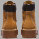 Stivale donna impermeabile giallo, retro con inserti scuri e suola plateau scanalata