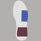 Suola della scarpa Tommy Jeans con inserto blu e profilo rosso.