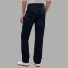 Tommy Hilfiger jeans slim dritti blu scuro con cuciture contrasto e dettagli in pelle sul retro