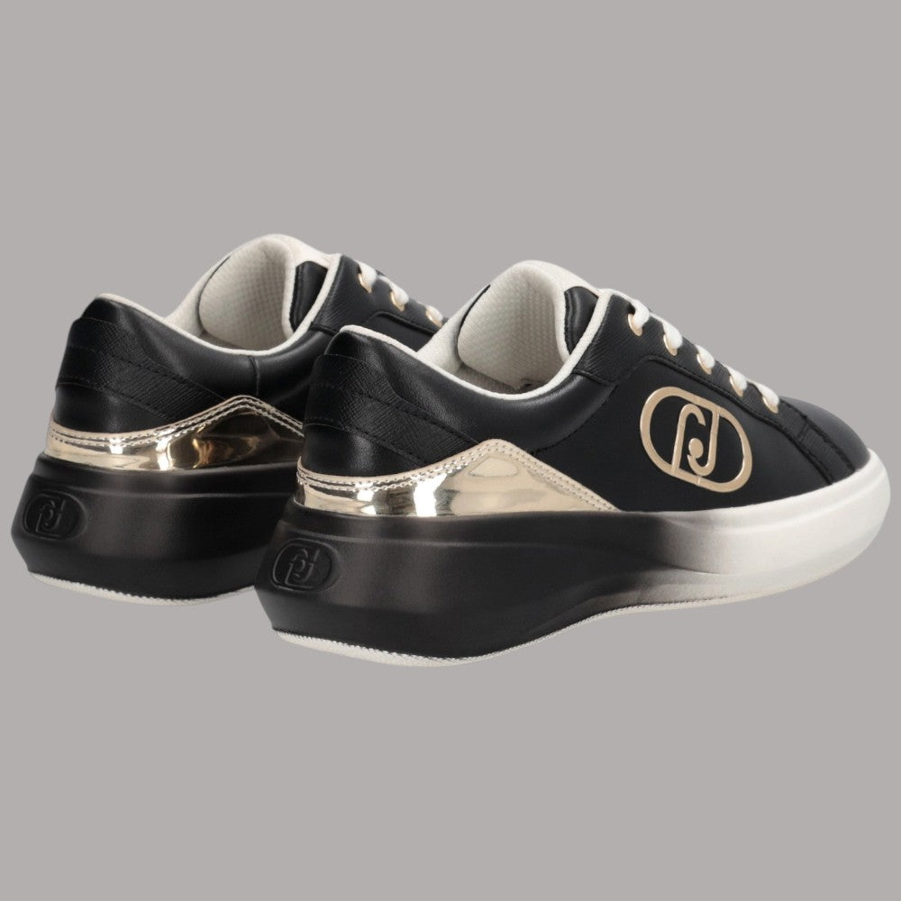 Scarpe da ginnastica nere con finitura lucida, insert oro e logo metallico laterale