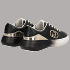 Scarpe da ginnastica nere con finitura lucida, insert oro e logo metallico laterale