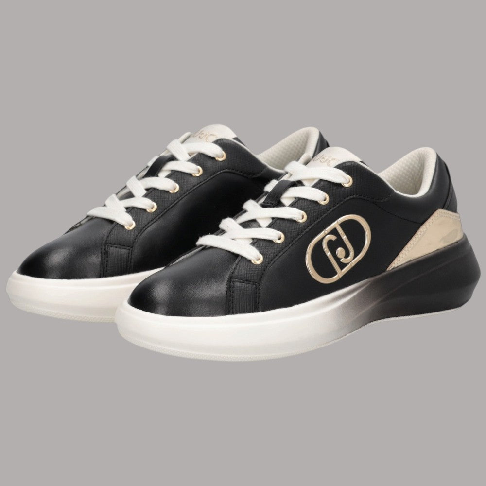 Scarpe da ginnastica nere con insert beige e logo metallico, suola platform