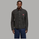 Camicia oversize Dickies in denim di cotone nero, bottoni e tasche sul petto.