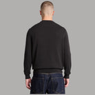 Maglione Timberland nero visto da dietro, con maniche lunghe e orlo a costine