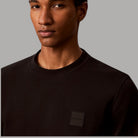 Felpa uomo Calvin Klein nera con patch logo sul torace