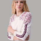 Liu Jo maglia jacquard con dettaglio floreale color crema e bordo a righe bordo manica